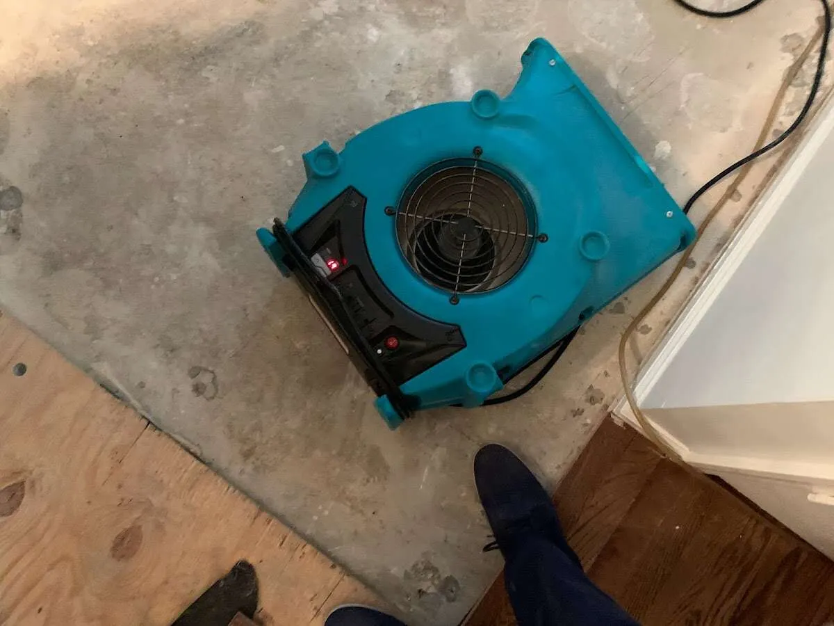 Air mover drying subfloor during Leak Detection & Repair in Warrensville Heights